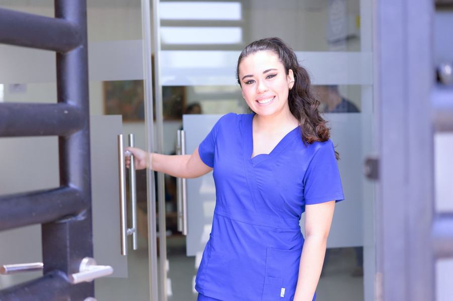 Smiling healthcare worker in scrubs