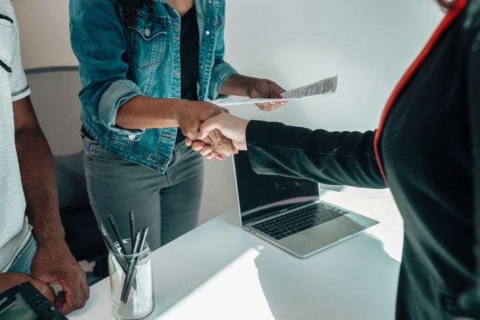 Handshake at the end of a job interview for staffing and recruitment